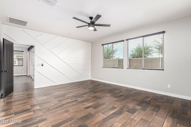 21972 N 97th Gln, Peoria, AZ 85383 - spare room featuring visible vents, ceiling fan, and wood finished floors