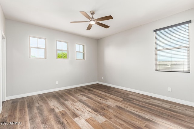 21972 N 97th Gln, Peoria, AZ 85383 - empty room featuring baseboards, ceiling fan, and wood finished floors