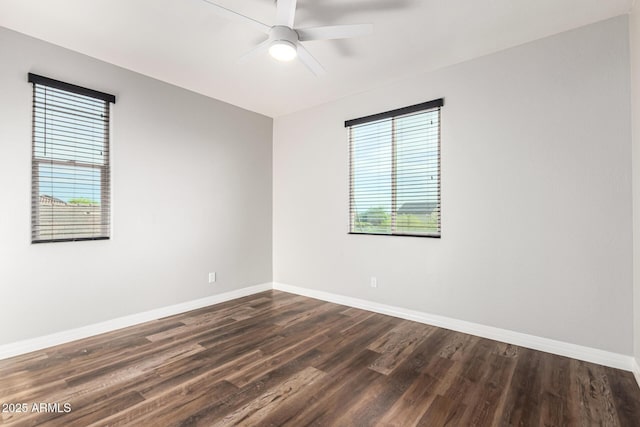 21972 N 97th Gln, Peoria, AZ 85383 - empty room with baseboards, a ceiling fan, and dark wood finished floors