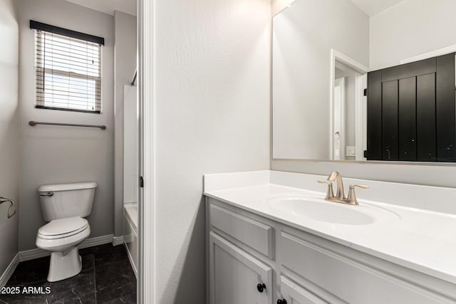 21972 N 97th Gln, Peoria, AZ 85383 - bathroom featuring vanity, baseboards, bathing tub / shower combination, and toilet