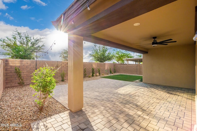 21972 N 97th Gln, Peoria, AZ 85383 - view of patio / terrace with a ceiling fan and a fenced backyard