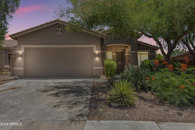 view of front of property featuring a garage