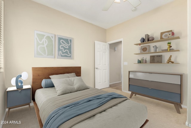 bedroom featuring ceiling fan and light colored carpet