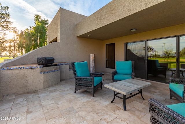 view of patio terrace at dusk