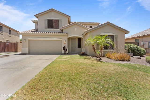 mediterranean / spanish house with a front lawn and a garage