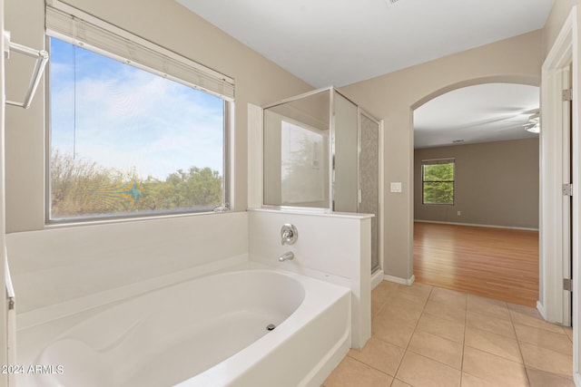 bathroom featuring shower with separate bathtub and hardwood / wood-style flooring