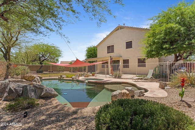 view of pool with an in ground hot tub and a patio area