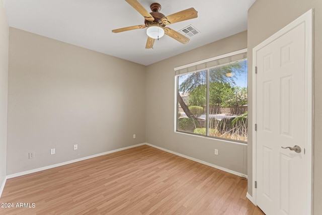 unfurnished room featuring ceiling fan and light wood-type flooring