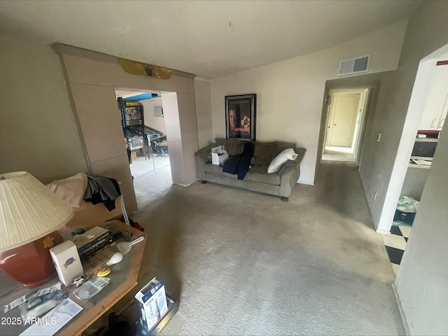 living area featuring carpet and visible vents