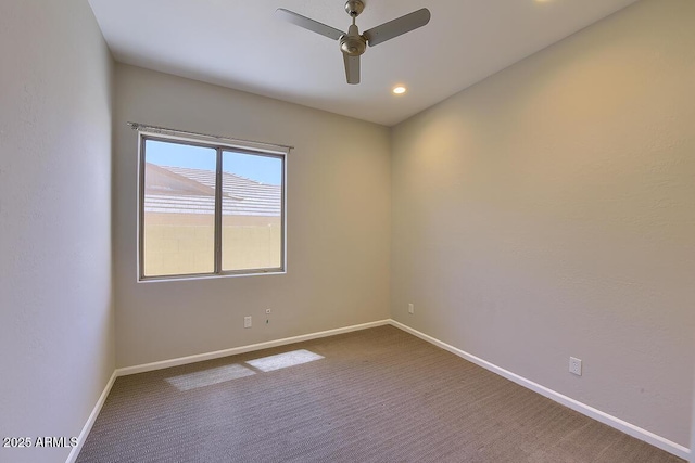 unfurnished room with baseboards, a ceiling fan, and carpet flooring