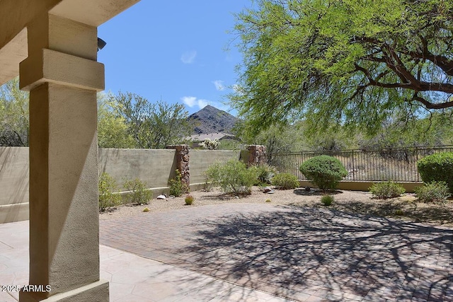view of patio featuring fence
