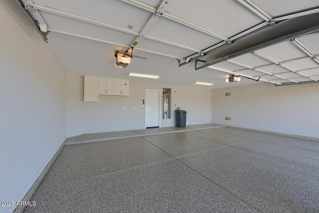 garage featuring baseboards and a garage door opener