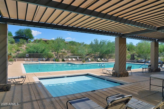 community pool with fence, a pergola, and a community hot tub