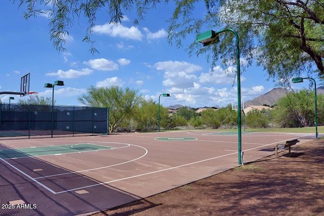 view of sport court featuring community basketball court and fence