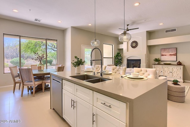 kitchen featuring recessed lighting, a sink, and dishwasher