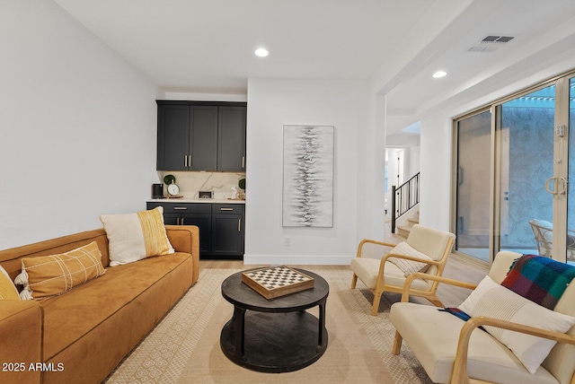 living room with light hardwood / wood-style floors