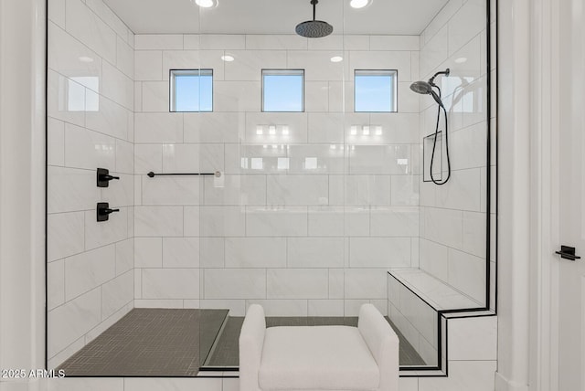 bathroom with a tile shower