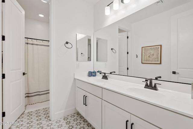 bathroom featuring a shower with curtain and vanity