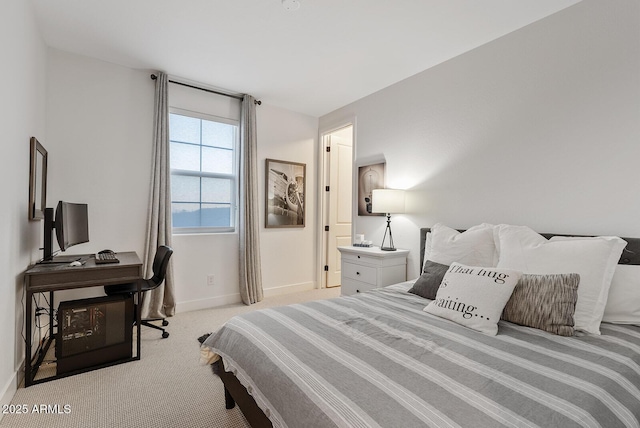 bedroom featuring light carpet