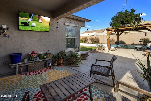 view of patio / terrace featuring a gazebo and fence