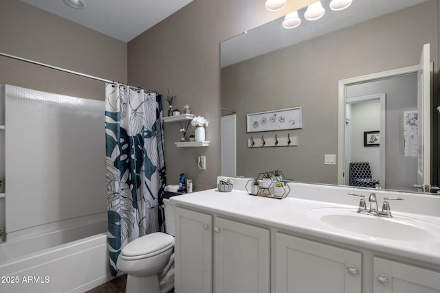 bathroom featuring toilet, vanity, and shower / bath combo