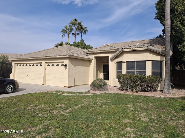 view of front of property featuring a garage and a front lawn