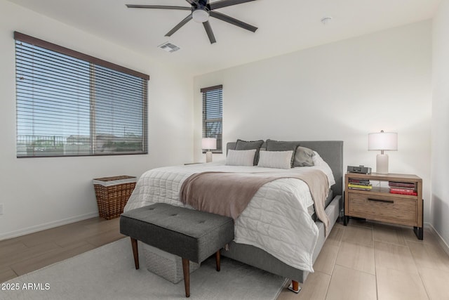 17973 W Ashley Dr, Goodyear, AZ 85338 - bedroom featuring baseboards, ceiling fan, and light wood-style flooring