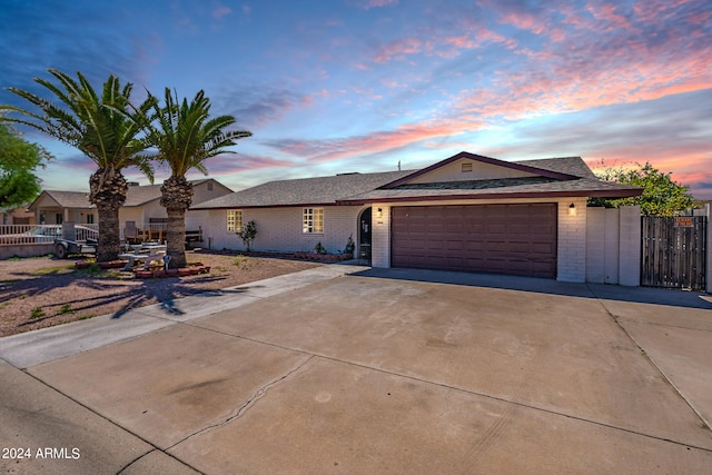 single story home featuring a garage