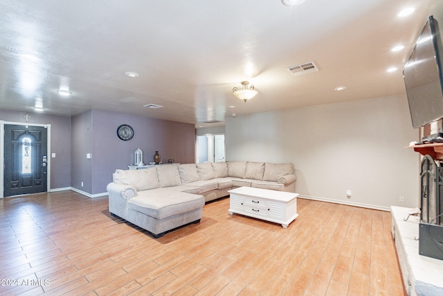 living room with light hardwood / wood-style flooring