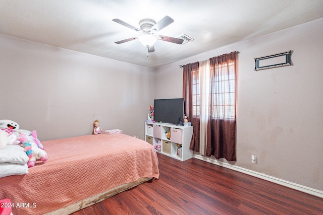 bedroom featuring dark hardwood / wood-style flooring and ceiling fan