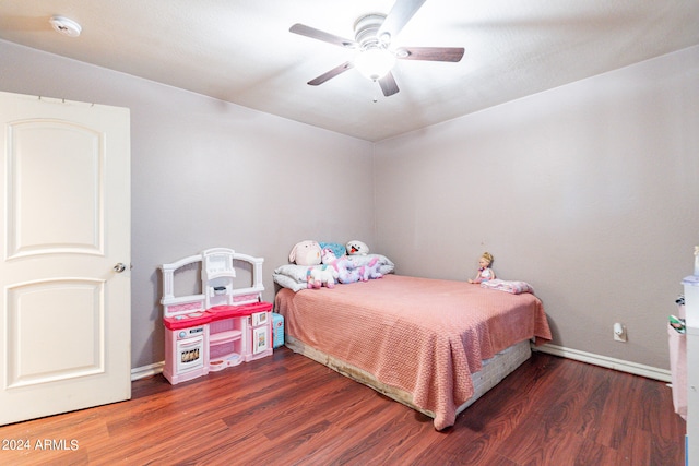 bedroom featuring ceiling fan and dark wood-type flooring