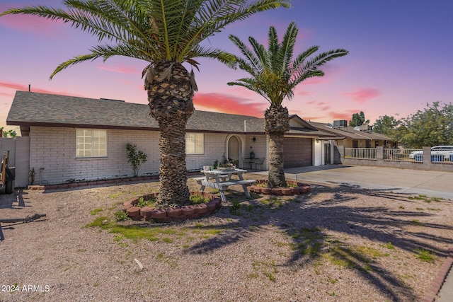 ranch-style home with a garage