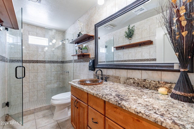 bathroom featuring tile walls, large vanity, tile flooring, tasteful backsplash, and toilet