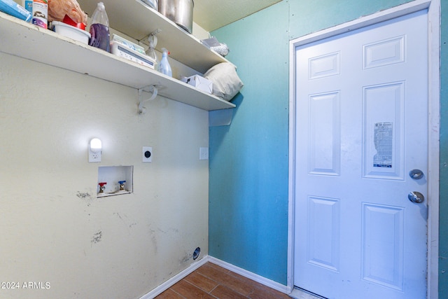 clothes washing area featuring hookup for a washing machine, hookup for an electric dryer, and dark hardwood / wood-style floors