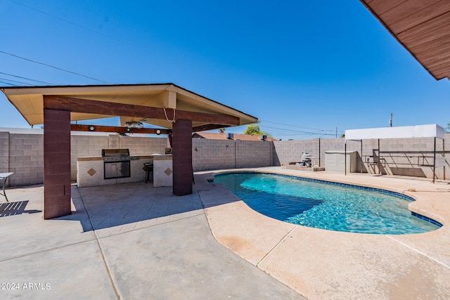 view of swimming pool featuring a patio area and ceiling fan