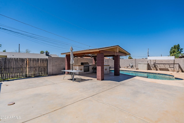 view of patio / terrace featuring a gazebo and a fenced in pool