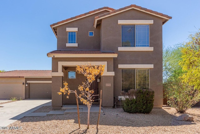 8795 W Windsor Dr, Peoria, AZ 85381 - view of front of house with concrete driveway, a garage, and stucco siding