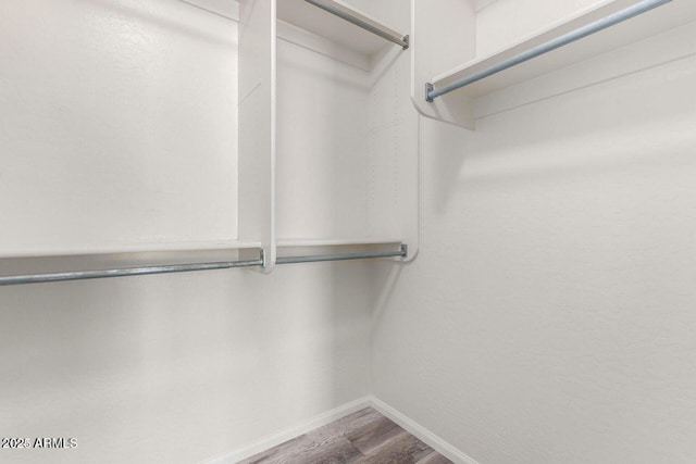 8795 W Windsor Dr, Peoria, AZ 85381 - spacious closet featuring wood finished floors