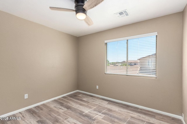8795 W Windsor Dr, Peoria, AZ 85381 - empty room with wood finished floors, a ceiling fan, and baseboards