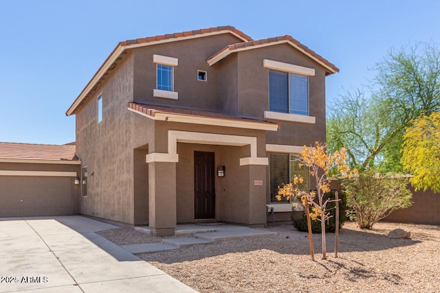 8795 W Windsor Dr, Peoria, AZ 85381 - view of front of house featuring concrete driveway, stucco siding, and a garage