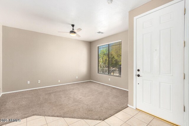 8795 W Windsor Dr, Peoria, AZ 85381 - empty room with light colored carpet, ceiling fan, baseboards, and light tile patterned floors