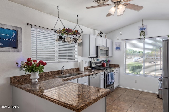 10465 W Windsor Blvd, Glendale, AZ 85307 - kitchen featuring a sink, stainless steel appliances, lofted ceiling, ceiling fan, and white cabinets