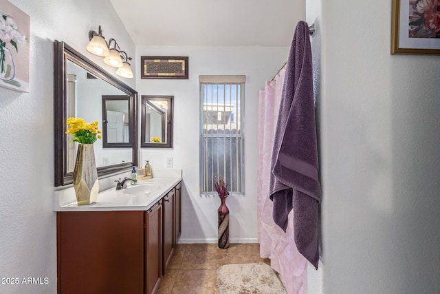 10465 W Windsor Blvd, Glendale, AZ 85307 - bathroom featuring vanity, tile patterned flooring, and baseboards