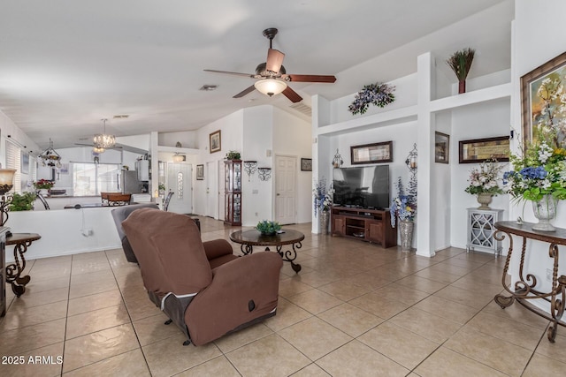 10465 W Windsor Blvd, Glendale, AZ 85307 - living area featuring vaulted ceiling, light tile patterned floors, ceiling fan, and a chandelier