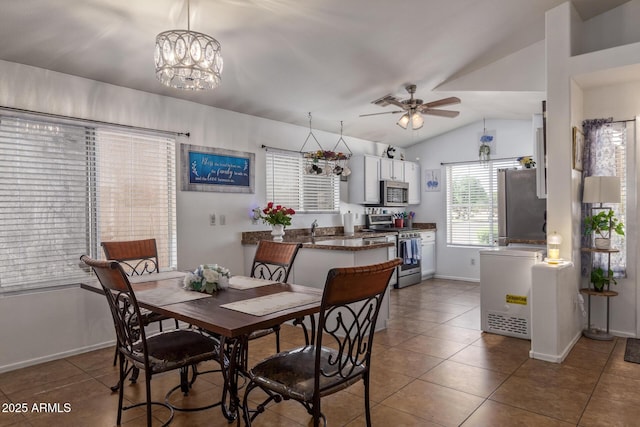 10465 W Windsor Blvd, Glendale, AZ 85307 - dining area with tile patterned flooring, a ceiling fan, vaulted ceiling, and baseboards