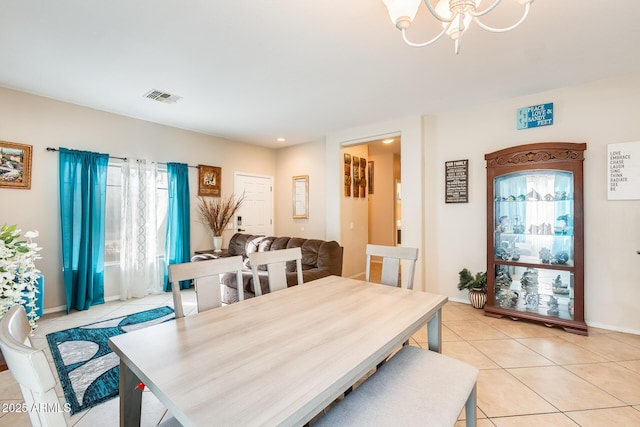 dining area featuring light tile patterned floors