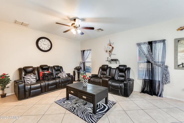 living room with light tile patterned floors and ceiling fan