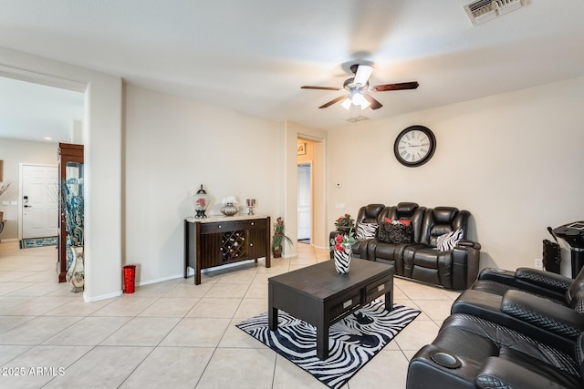 tiled living room with ceiling fan