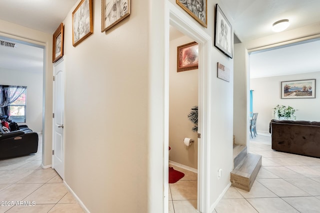 corridor with light tile patterned floors