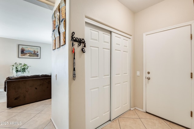 entryway with light tile patterned floors